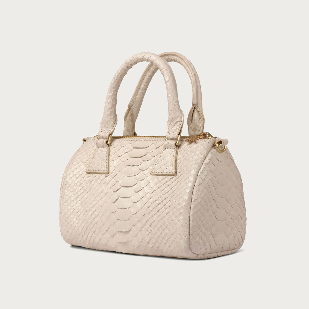 White textured handbag on a light gray background