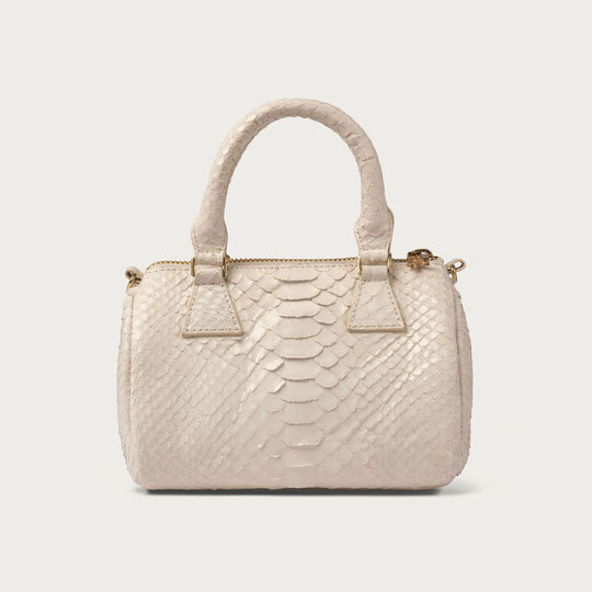 White textured handbag on a light gray background