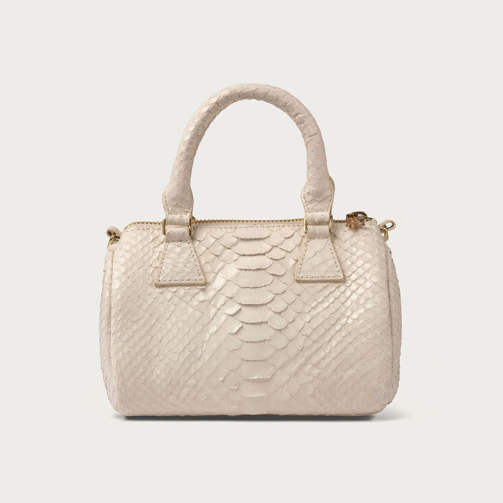 White textured handbag on a light gray background