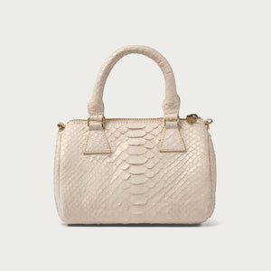 White textured handbag on a light gray background