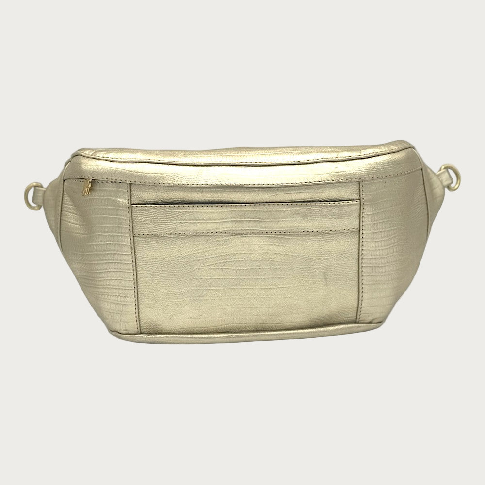 A gold leather sling bag with an embossed lizard pattern, featuring a front pocket with magnetic closure and solid brass hardware.